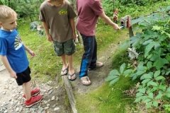 Secret-Garden.3-boys-getting-a-note-from-the-elf-mailbox